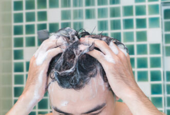 Closeup men washing hair and taking a shower