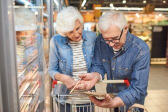 aged couple at grocery store