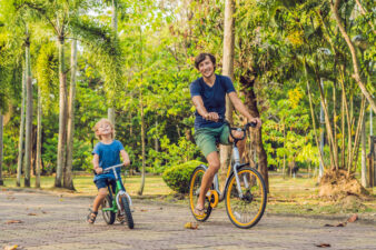 Father and son riding bikes