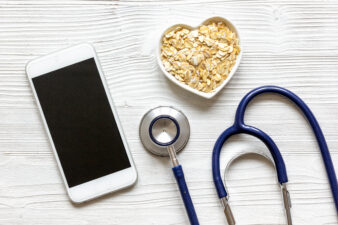 stethoscope, phone and heart full of grains