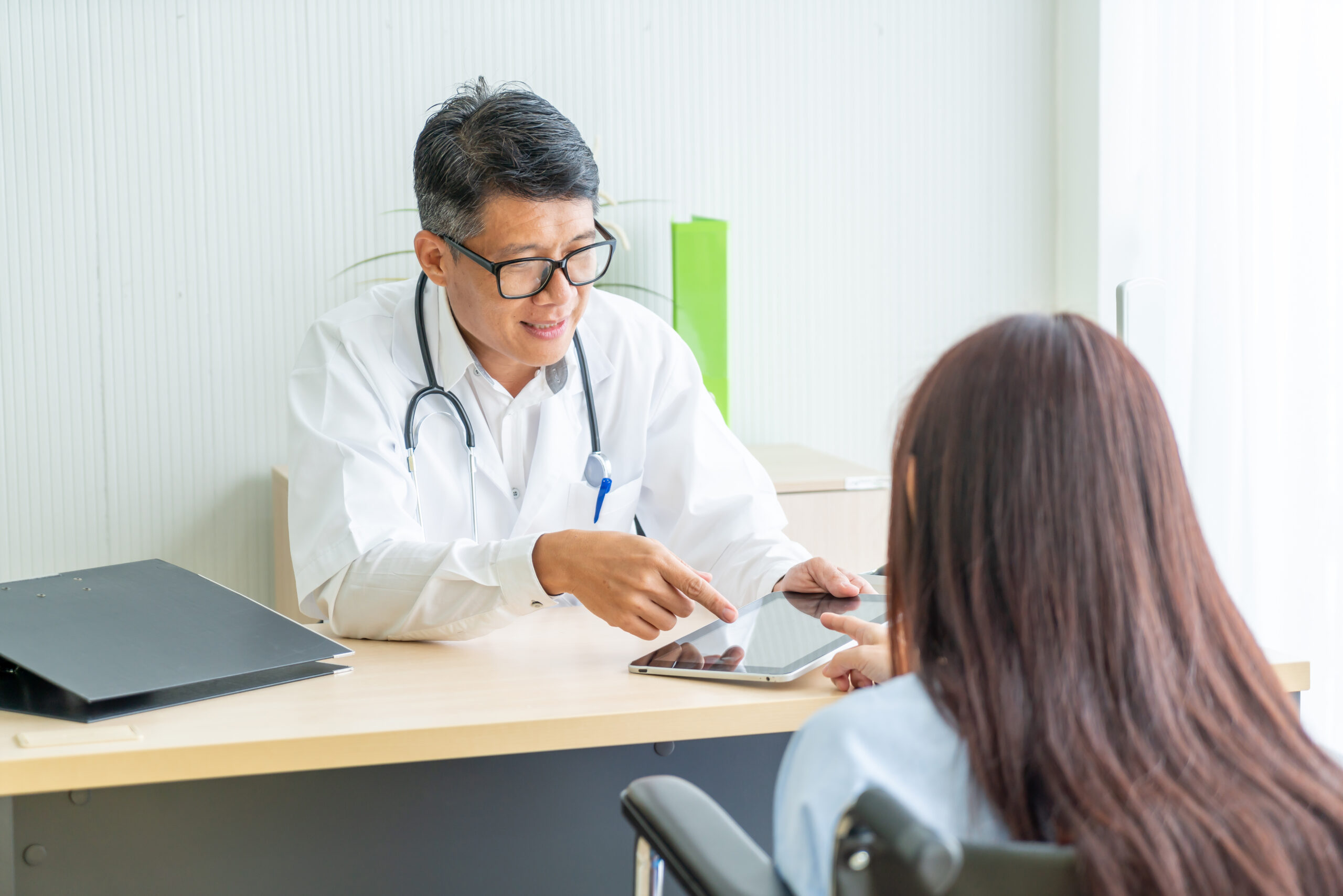 Asian doctor and patient are consultation