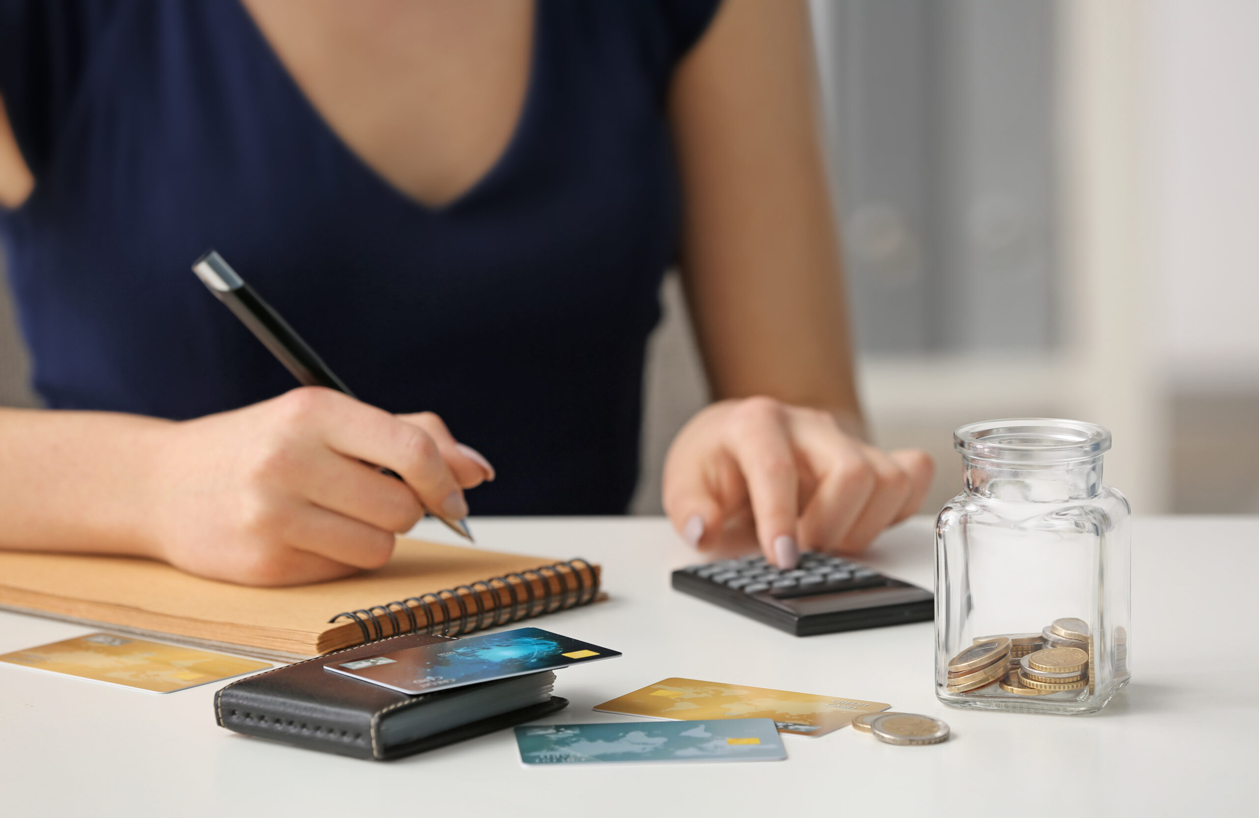 Woman counting income at table