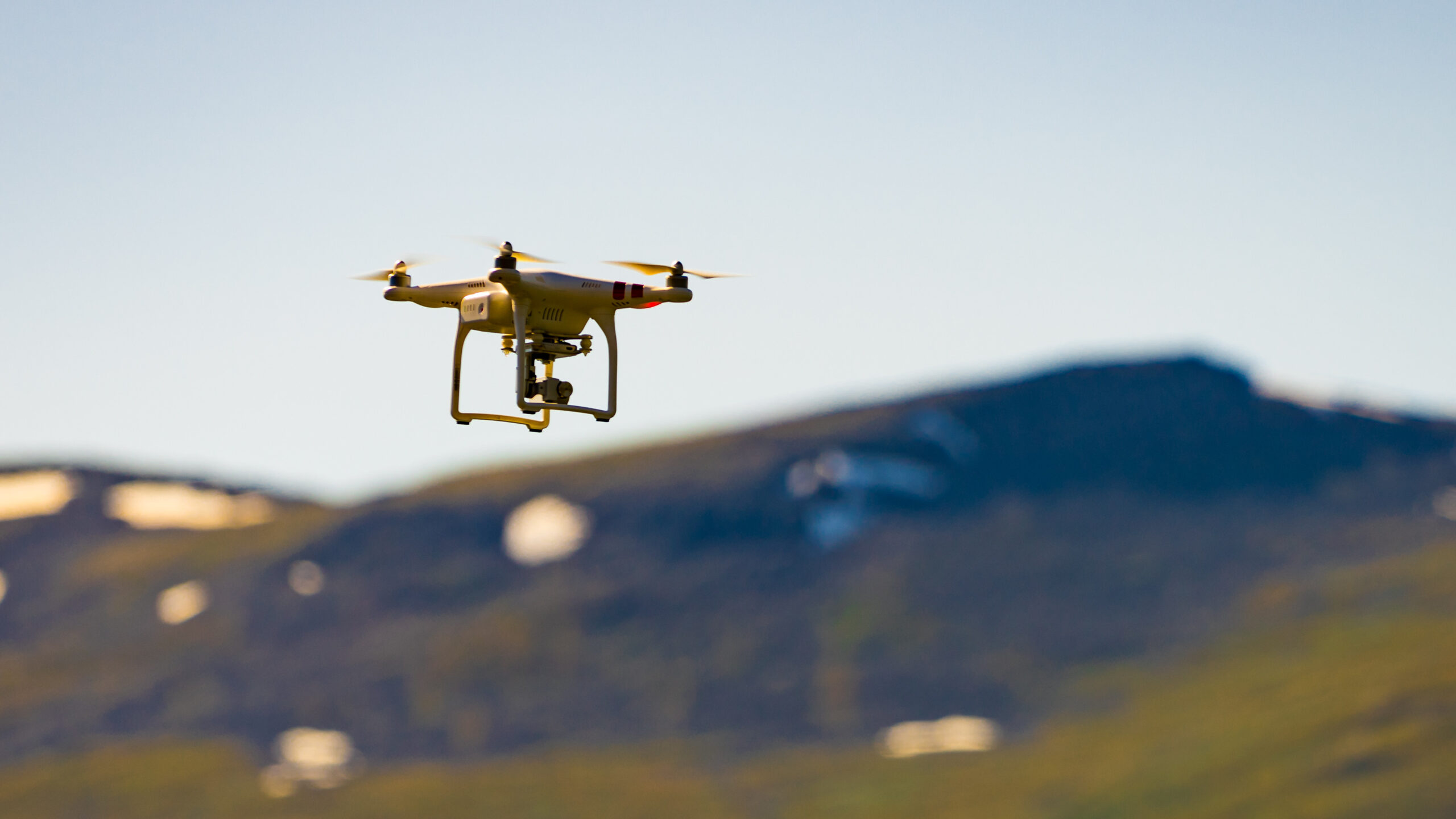 Drone flying against norwegian nature