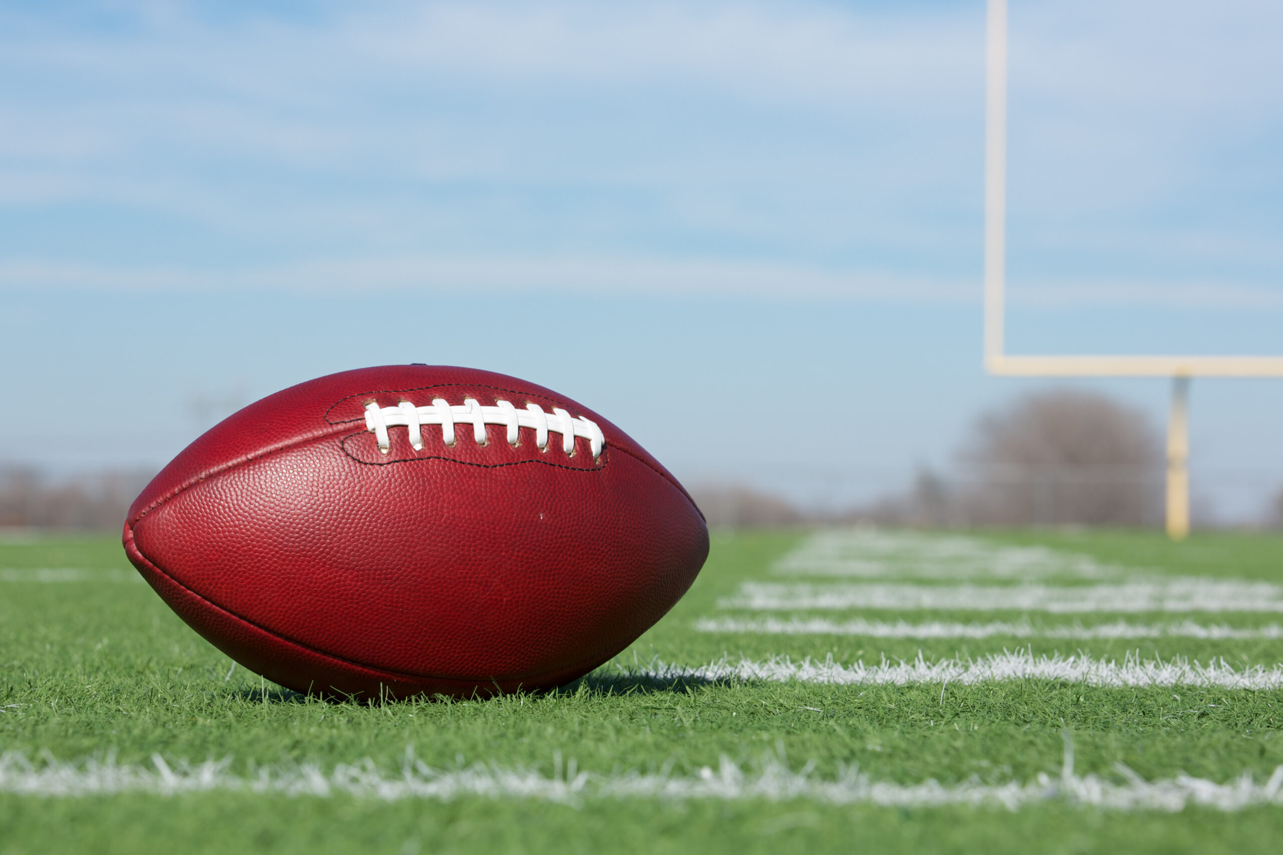 Football on green field