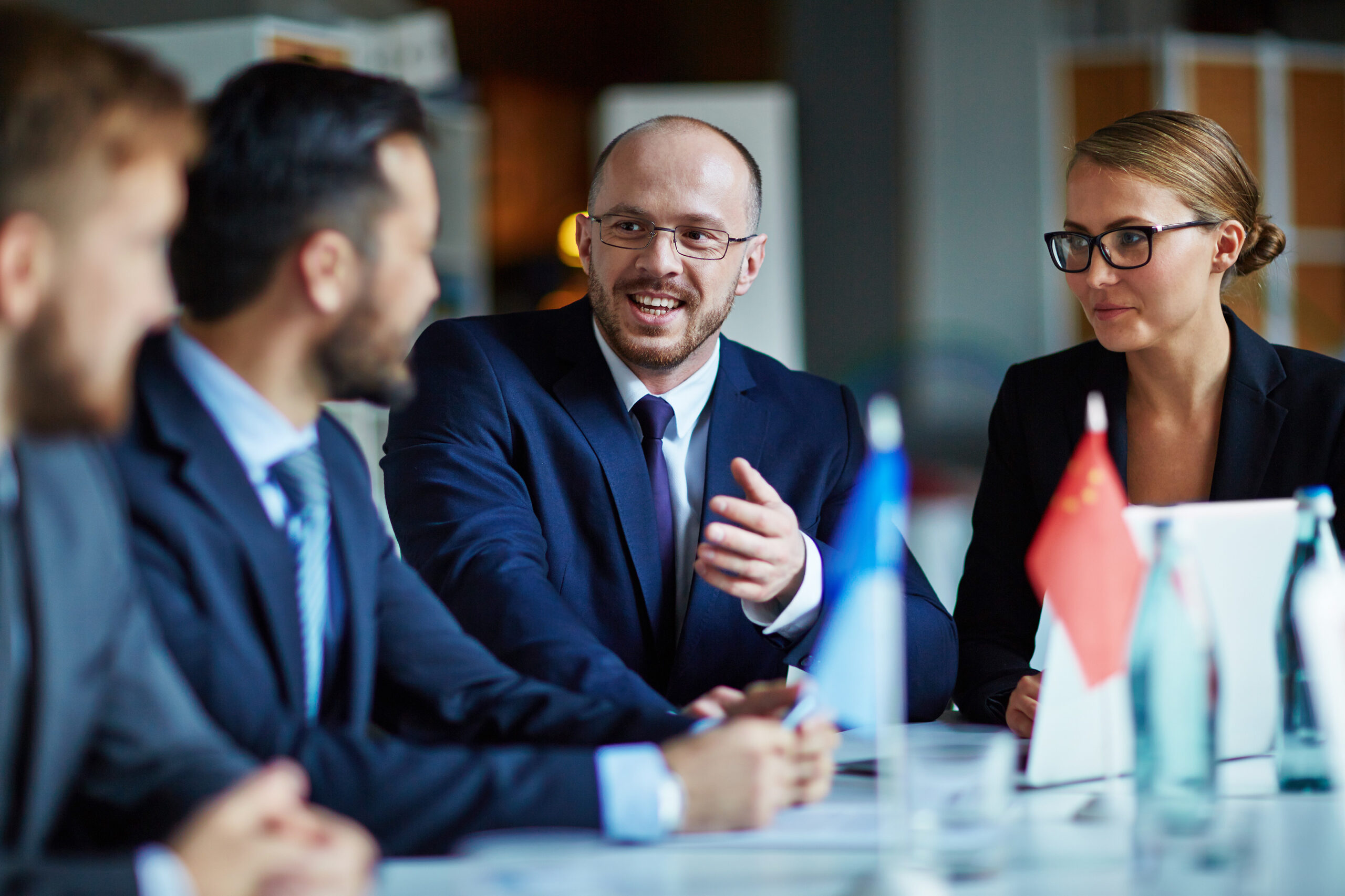 Man discussing work with team of employees