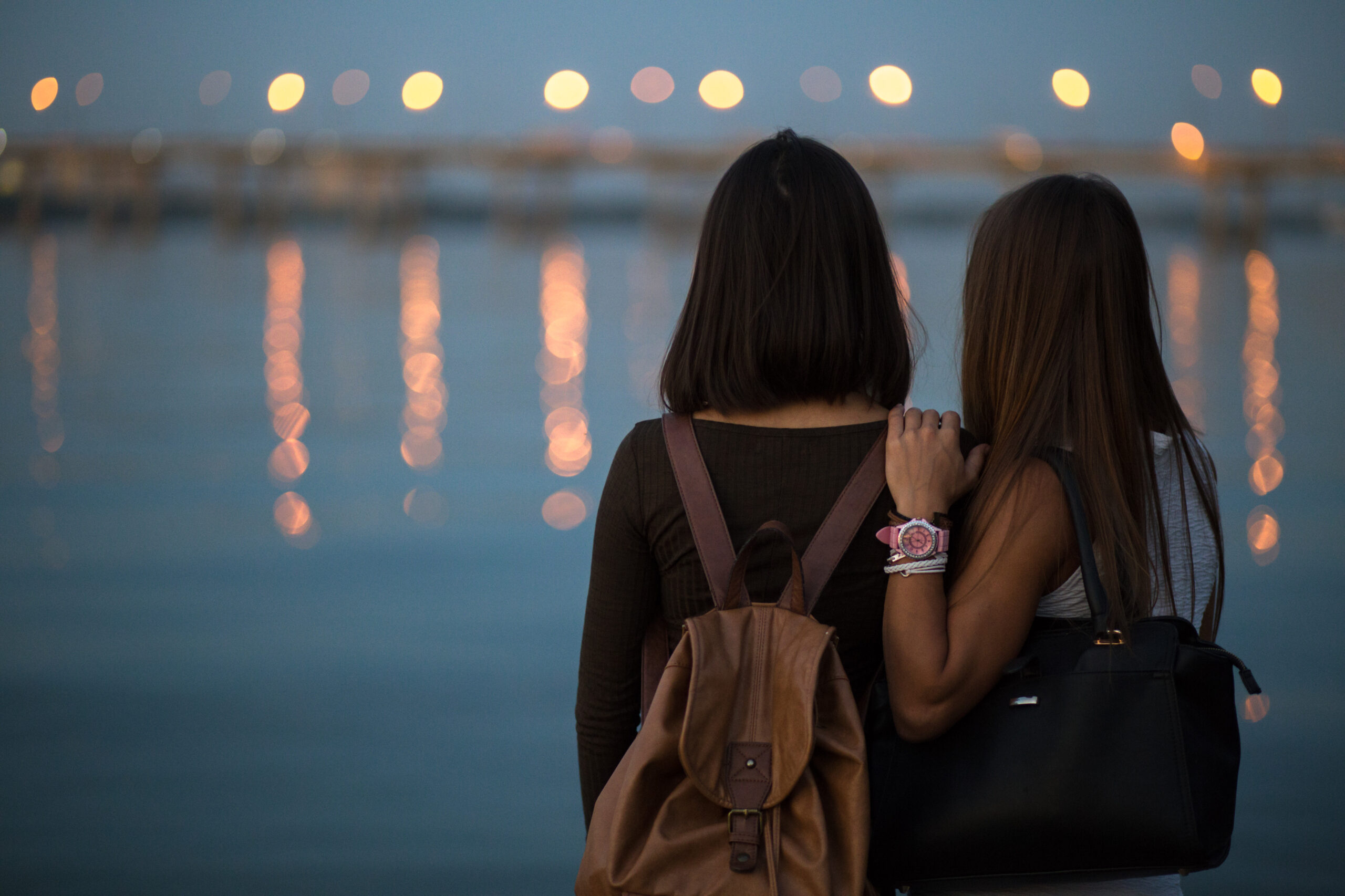 Two girlfriends are back at the river in evening