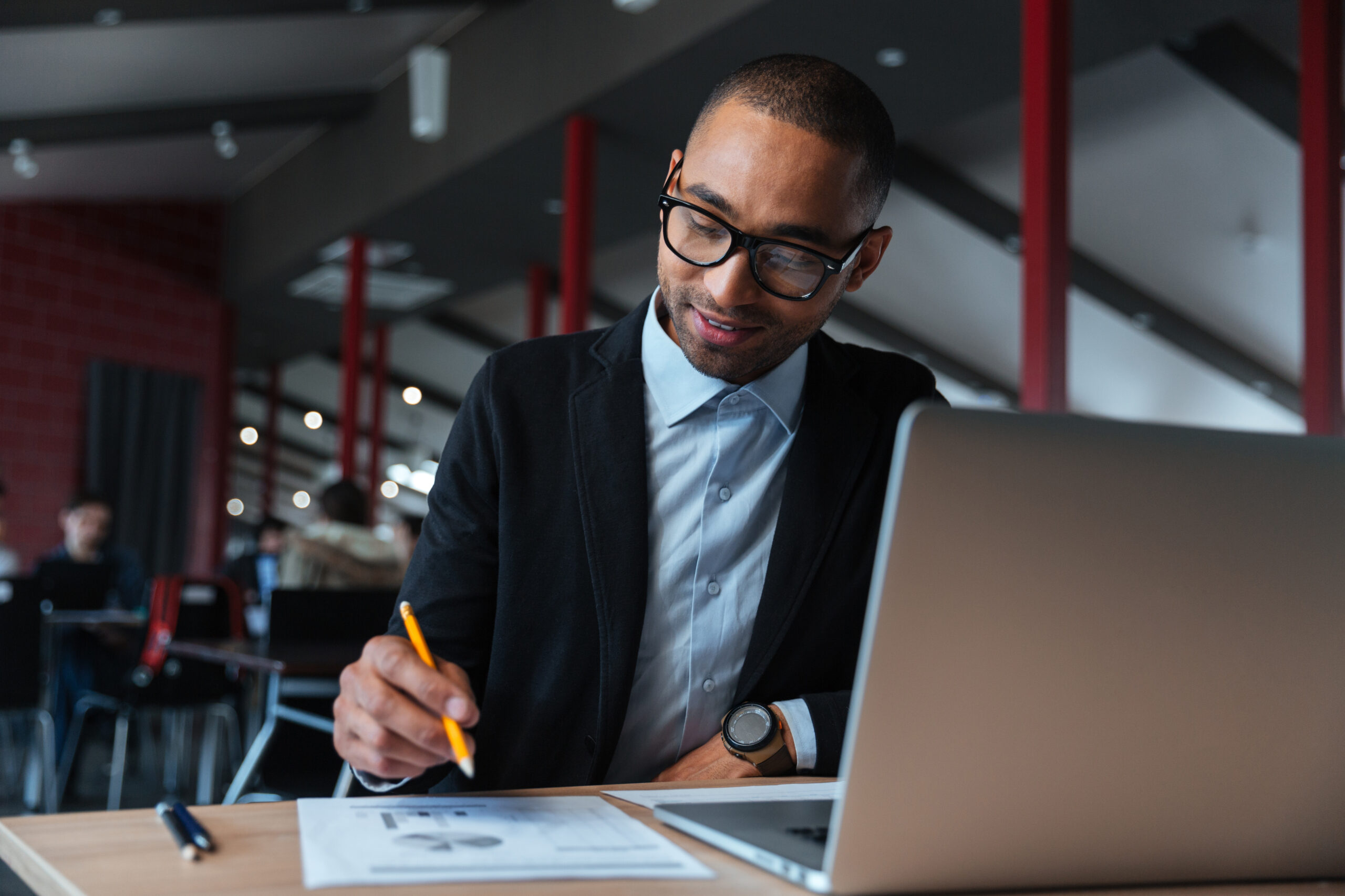 Young businessman working with laptop