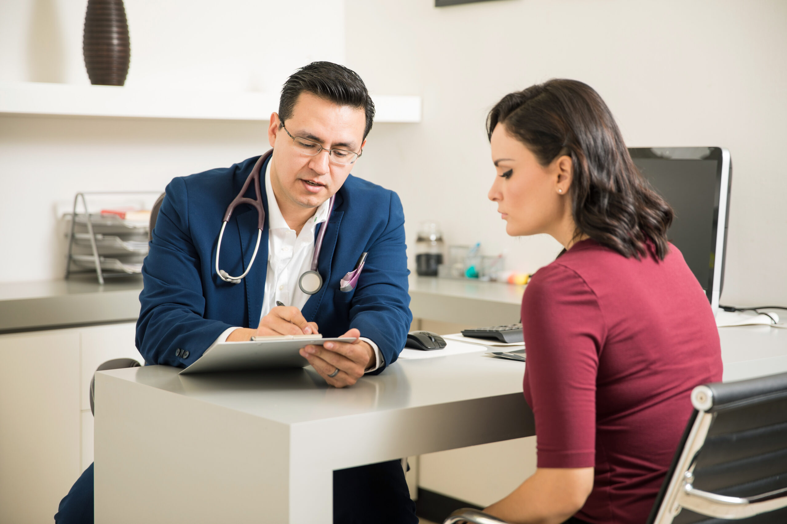 Doctor reviewing medical history of patient