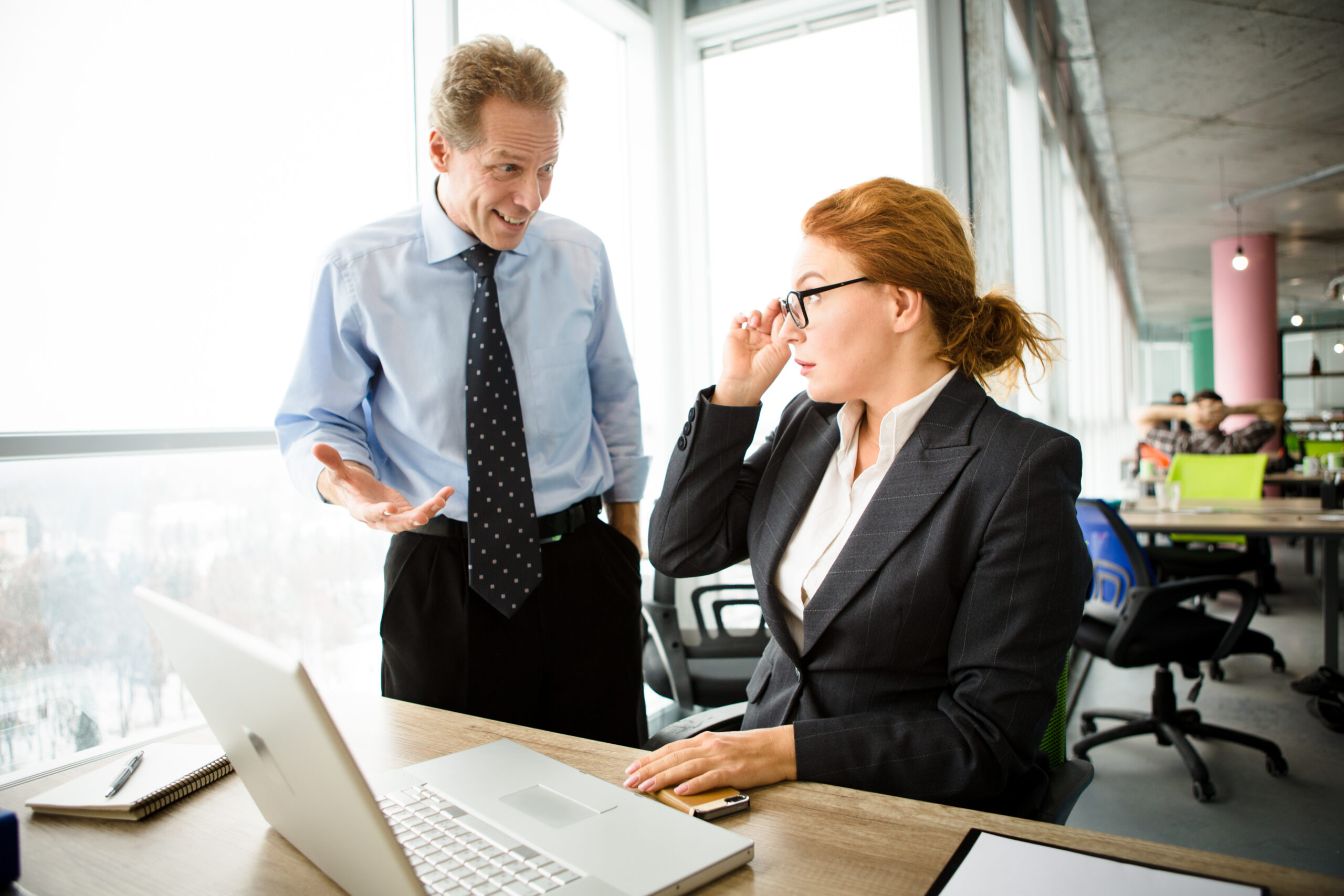 Angry boss screaming at workers