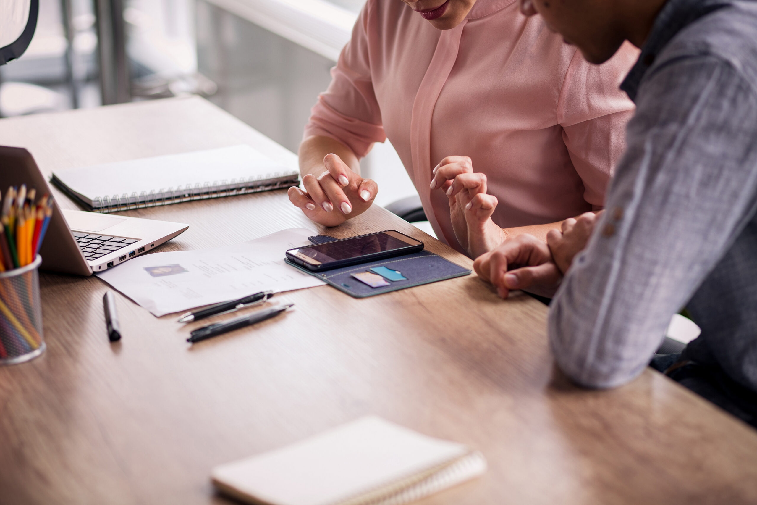 Two people working on a budget