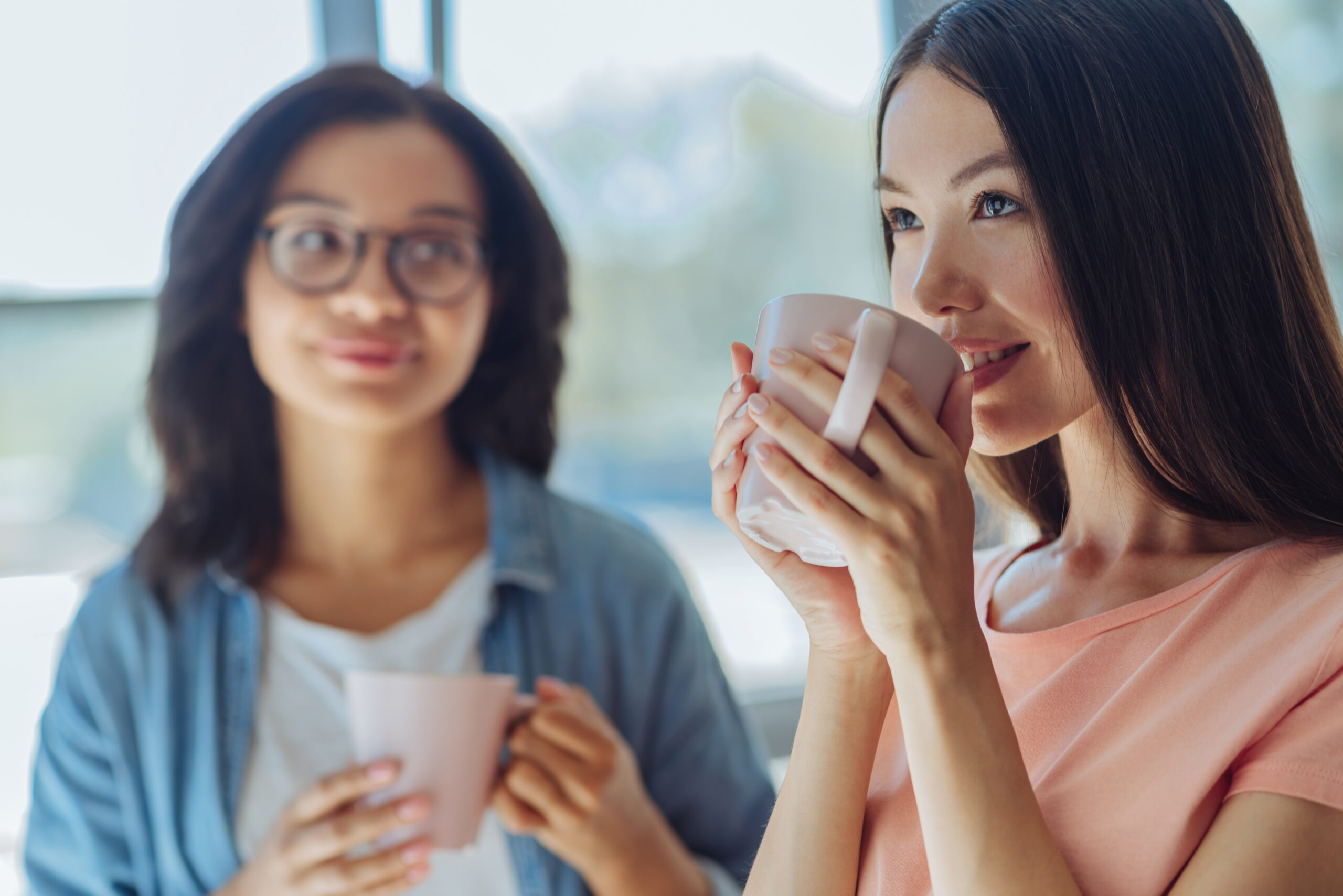 Two women having coffee together