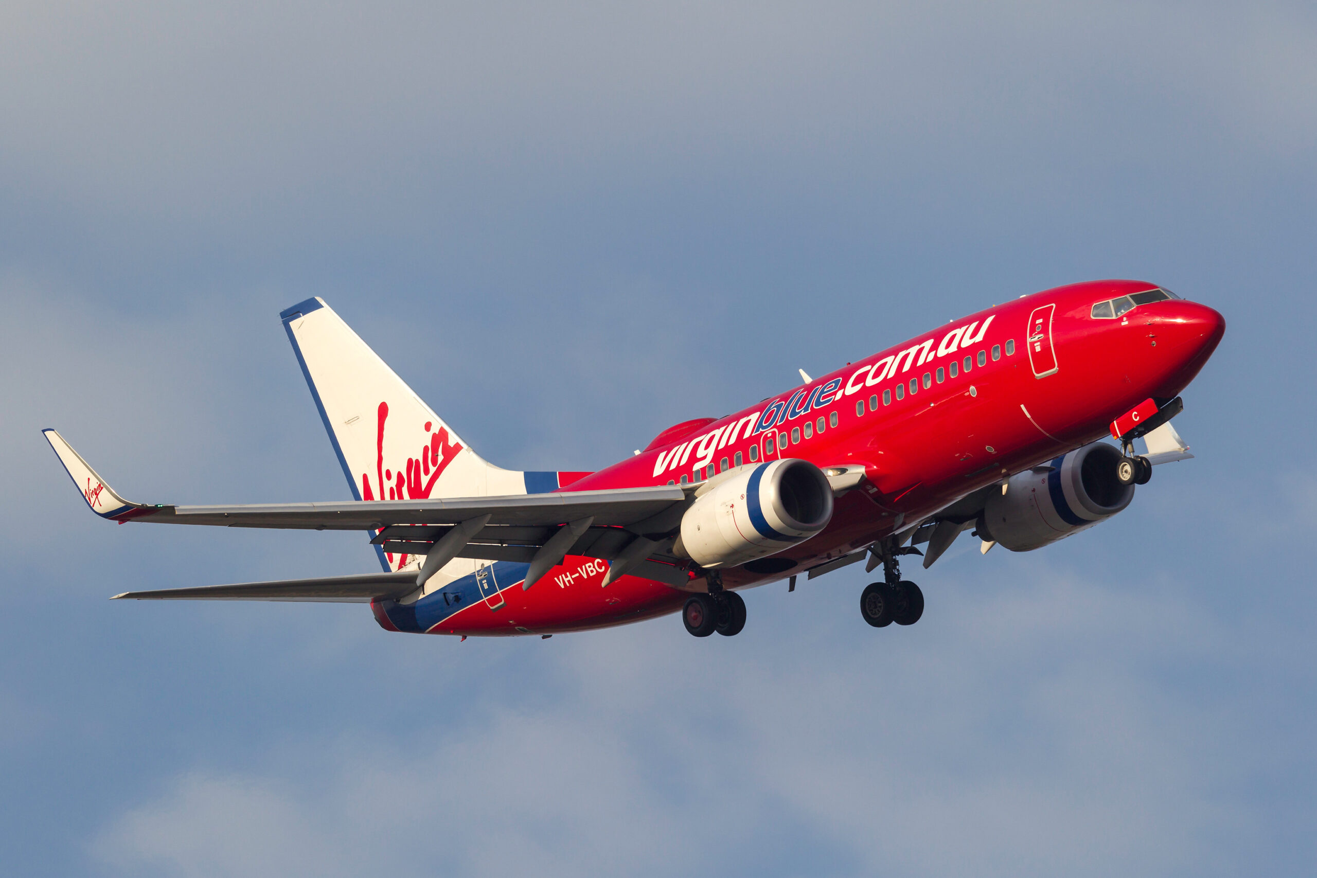 Melbourne, Australia - September 28, 2011: Virgin Blue Airlines Boeing 737-7Q8 VH-VBC turning on approach to land at Melbourne International Airport.