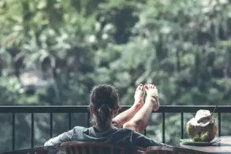 Young woman with her legs up looking at nature