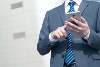 Business man using his smartphone