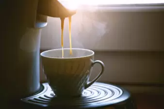 coffee machine making cup of coffee