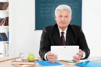 Senior teacher at lesson in classroom