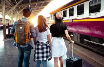 Group of tourists boarding a train