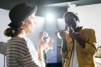 young couple singing together on a stage