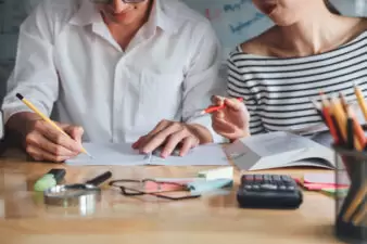 man and woman discussing budget