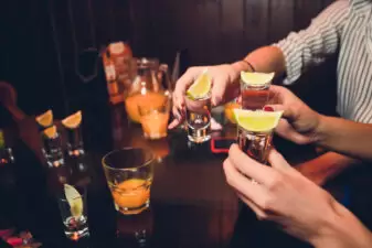 group of women drinking shots