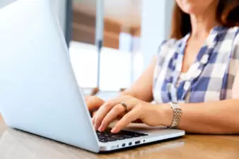 Woman typing on laptop