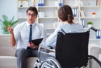 woman in a wheelchair in an interview