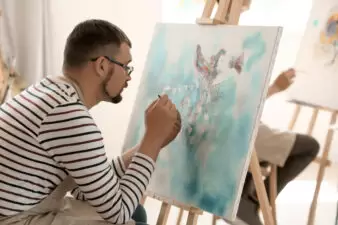 Man painting a canvas