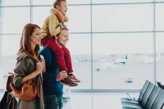 Excited family is getting ready to travel by air