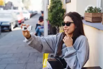 young woman taking a suggestive selfie