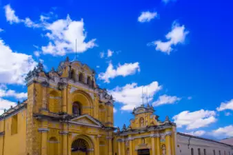 Ciudad de Guatemala, Guatemala, April, 25, 2018: View of Hermano Pedro church, typical street scene in Spanish colonial town of Antigua in Antigua