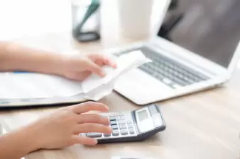 woman calculating the costs of a bill