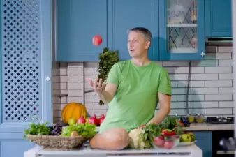 man preparing fresh foods in the kitchen