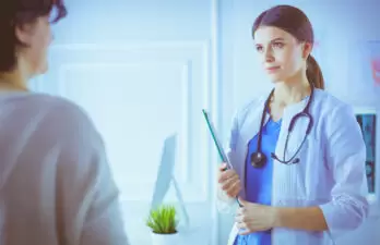 Female doctor speaking with a patient