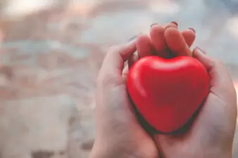 Woman holding red heart