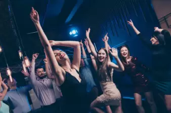 Women dancing in night club