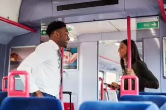 Business passengers talking on train