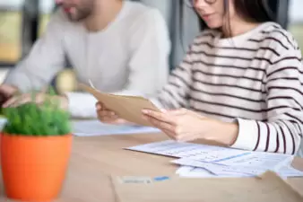 woman and man looking over a budget