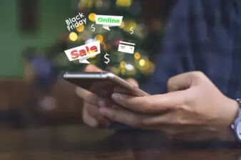 hand holding a smartphone looking at coupons and savings