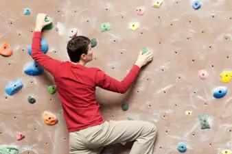 man on a rock climbing wall