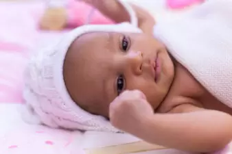 Adorable black baby girl lying down