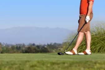 Closeup of man golfing