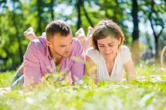 couple lying in the grass