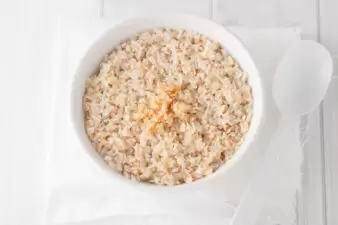 a bowl of cooked oatmeal with brown sugar