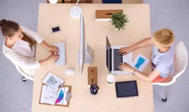 Two female employees working across from each other