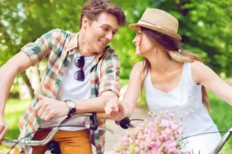 Loving couple on bicycles