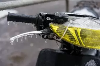 Wet handle of scooter in rain