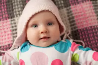 Close up cute baby in a pink hat