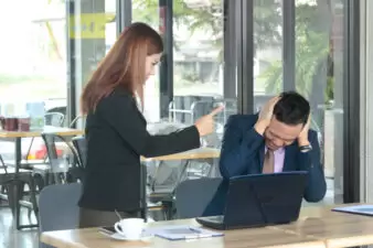 Angry boss woman accusing man to making business failure in firm