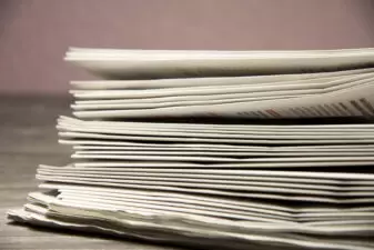 Stack of newspapers on the table