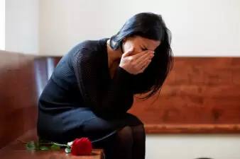 crying woman at funeral